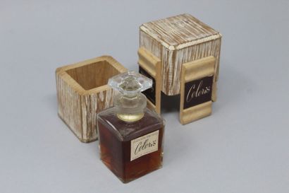  MARCELLE DORMOY "Coloris 
 
Glass perfume bottle in its original wooden box, still...