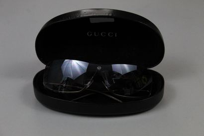 GUCCI 
Pair of sunglasses, tinted glasses...