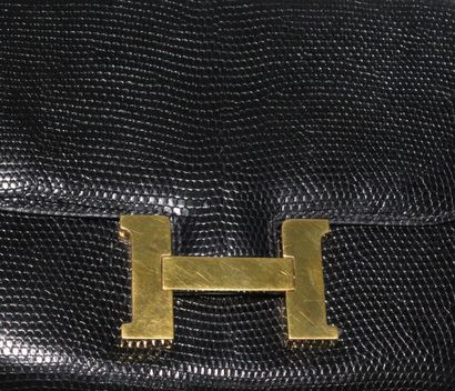 null HERMES (1992)



Hermes "Constance" bag in black lizard and gold metal, black...