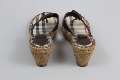  BURBERRY 
 
Pair of tan leather mules/tongs with rope heel. 
 
Size : 36 
 
Height...