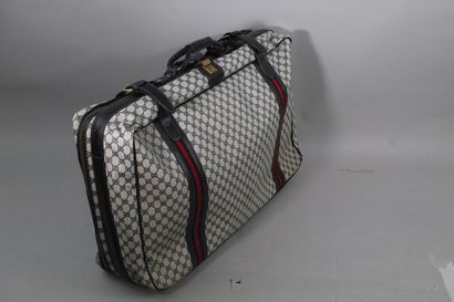 null GUCCI (circa 1970)



Semi-rigid suitcase in monogrammed canvas and midnight...
