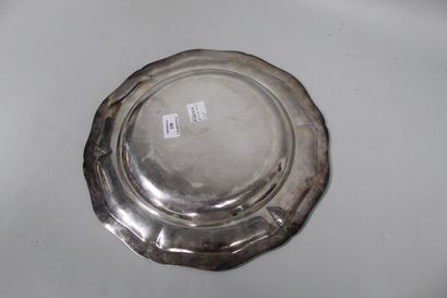 null A large round silver (950) dish, the border with contours and mouldings of ribboned...