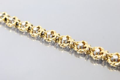 null VAN CLEEF & ARPELS

Bracelet souple entièrement articulé en or jaune 18K (750)...