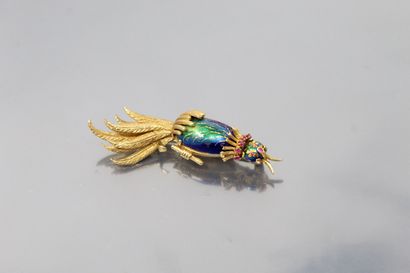 null An 18K (750) yellow gold "bird" brooch, the plumage chased and enamelled, the...