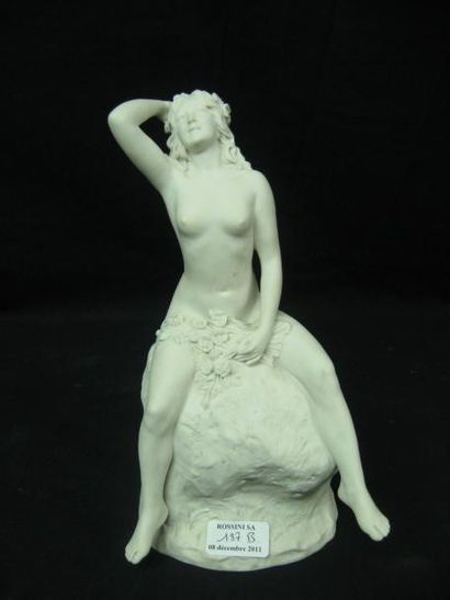 Joe Descomps (1869-1950) Biscuit représentant une femme voluptueuse assise nue sur...