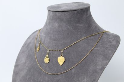 Two 18k (750) yellow gold chains, one with...