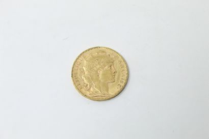 null Pièce en or de 20 francs au Coq 1907.

Poids : 6.45 g.