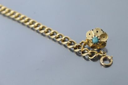 null Bracelet en or jaune 18k (750) à mailles gourmette, une fleur stylisée en breloque,...