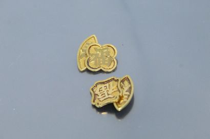 null Paire de boutons de manchettes en or jaune 14k (585) à décor de caractères chinois.

Poids...