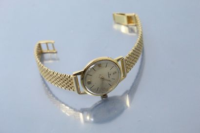 null TISSOT 

Montre bracelet de dame en or jaune 18k (750), boîtier rond, index...