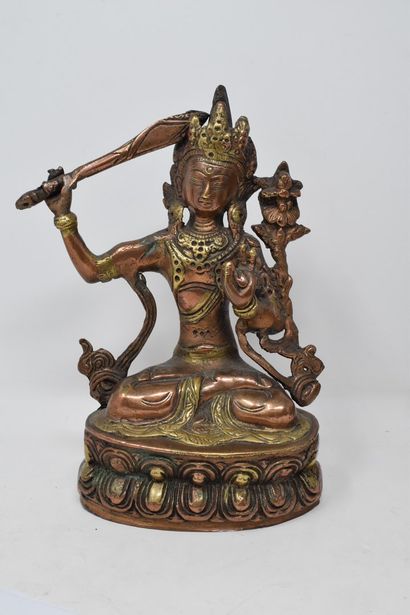 null NEPAL, 20th century,

Lot composed of two buddhas, the first one in copper alloy...