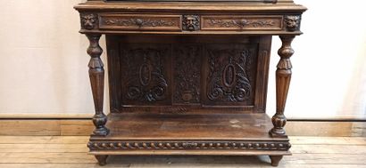 null Dresser in natural wood carved in the lower part of a decoration of scrolls,...