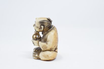 null JAPAN - 20th century

Carved ivory netsuke of a merchant with a scale

Signed...