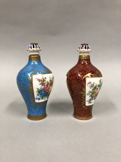 null A pair of Sevres porcelain bottles with floral decoration on a blue background...