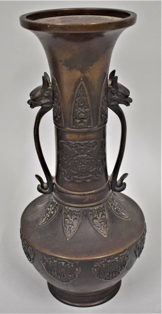 null China, 20th century

Brown patina bronze vase with a long flared neck decorated...