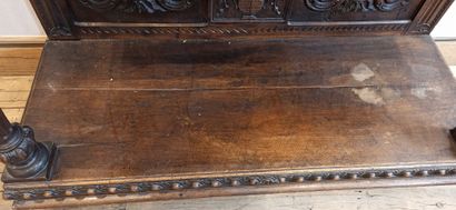 null Dresser in natural wood carved in the lower part of a decoration of scrolls,...