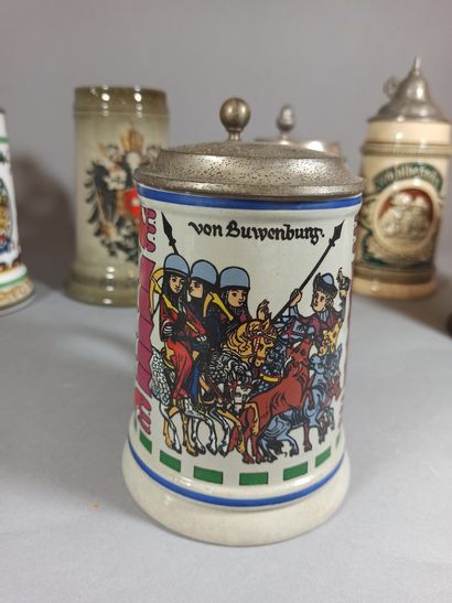 null German and Austrian work.

Set of 9 enamelled stoneware and porcelain beer mugs...