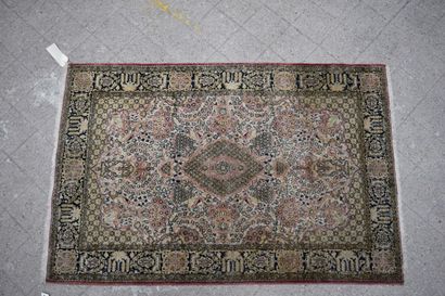 null Silk carpet with white background and black borders.

H : 155 cm - W : 105 ...