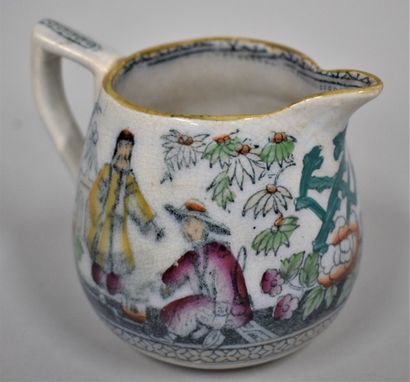 null Small earthenware milk jug with Chinese decoration

Lithographed decoration.

England,...