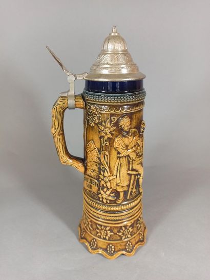 null German work.

Musical beer mug in enamelled stoneware with relief decoration...