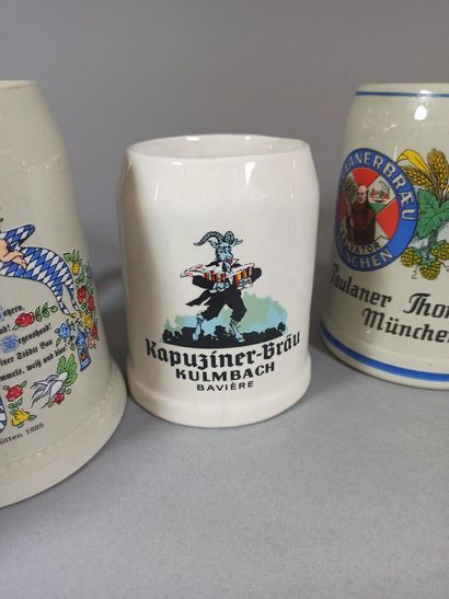null Set of 7 regional glazed ceramic beer mugs and advertising.

(Firing defect...