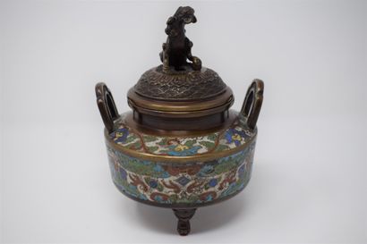 null CHINA

A bronze and cloisonné enamelled tripod incense burner, the grip in the...