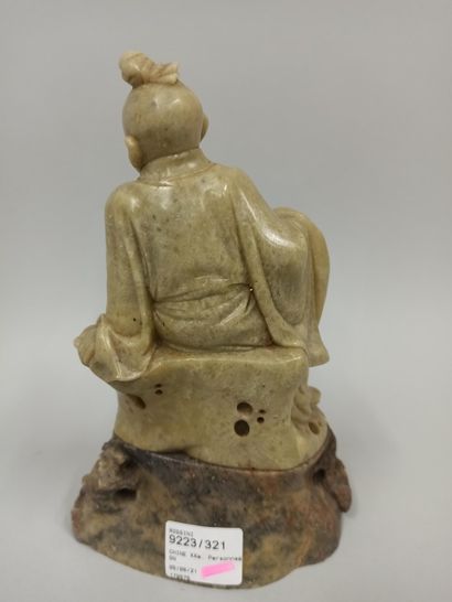null CHINA - 20th century

A steatite group of a child sitting on a rock with a flowery...