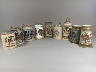 null German and Austrian work.

Set of 9 enamelled stoneware and porcelain beer mugs...