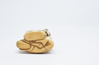 null JAPAN - 20th century

Carved ivory netsuke of a merchant with a scale

Signed...