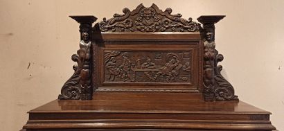 null Dresser in natural wood carved in the lower part of a decoration of scrolls,...