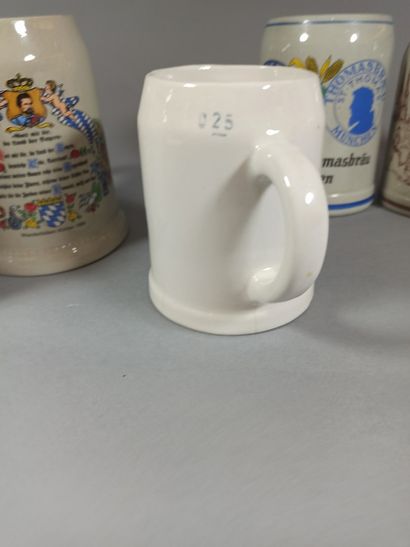 null Set of 7 regional glazed ceramic beer mugs and advertising.

(Firing defect...