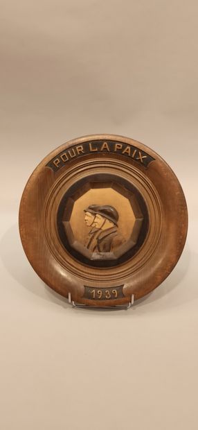 null Lot 2 G.M. comprising: a circular carved wooden medallion "For Peace 1939" signed...