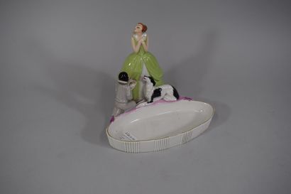 null Enameled porcelain pocket with a kneeling child holding a tray in front of a...