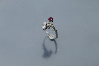 null 
14k (585) white gold ring set with a round ruby and three old-cut diamonds...