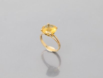 null 18k (750) yellow gold ring set with a round citrine. 

Finger size: 54 - Gross...