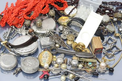 null Drawer bottoms: two wristwatches, various necklaces, a metal pocket watch with...