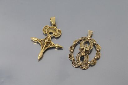 null Set of two filigree pendants, one styling a cross, the other a mask. 

Weight...