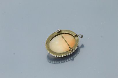 null Shell cameo showing a left female profile in a frame of pearls, metal mounting,...