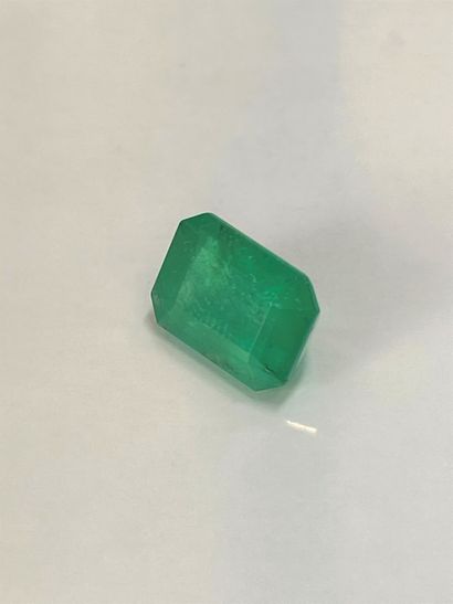 null Emerald ranctangular with cut sides on paper.

Accompanied by a GIA certificate...