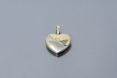 null Yellow and white gold pendant in the shape of a heart, decorated with a white...