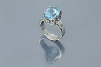 null Silver ring set with an oval topaz in a diamond setting. 

Weight of the topaz:...