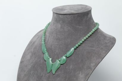 null Necklace in jadeite, the base decorated with stylized leaves.

Necklace size:...