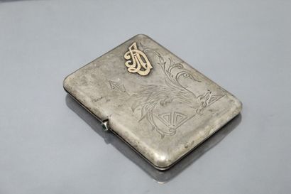 null Silver cigarette case, the body engraved with scrolls and figured. The push...