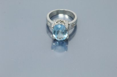 null Silver ring set with an oval topaz in a diamond setting. 

Weight of the topaz:...