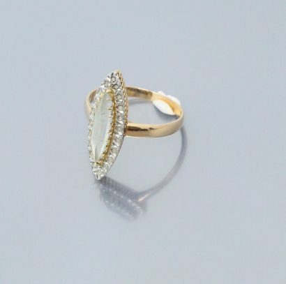 null 18k (750) yellow and white gold navette ring set with a fine navette stone in...