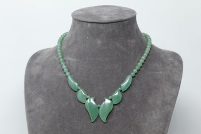 null Necklace in jadeite, the base decorated with stylized leaves.

Necklace size:...