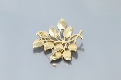 null Brooch stylizing a leafy branch in gilt metal.

Signed "Trifari" on the back.

Dimensions:...