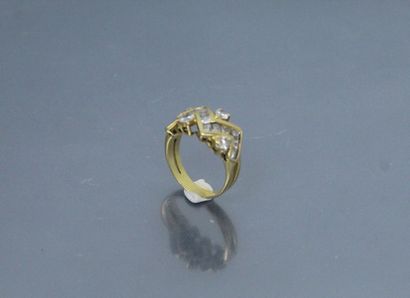 null 18k (750) yellow gold ring set with round and princess diamonds. 

Finger size...