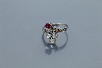 null 
14k (585) white gold ring set with a round ruby and three old-cut diamonds...