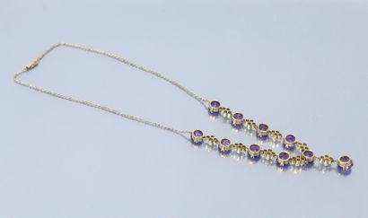 null Gilt metal necklace decorated with ten round amethysts separated by four pearls....